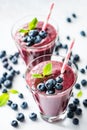 Blueberry acai smoothie in glass on white background Royalty Free Stock Photo