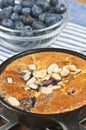 Blueberry almond claufoutis in a cast iron pan paleo diet Royalty Free Stock Photo