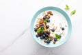 Blueberry and almond granola with greek yogurt, cottage cheese and fresh berries, top view