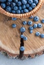 Blueberry in basket on wooden table background. Ripe and juicy fresh picked blueberries closeup, top view Royalty Free Stock Photo