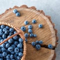 Blueberry in basket on wooden table background. Ripe and juicy fresh picked blueberries closeup, top view Royalty Free Stock Photo