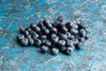 Blueberry berry on table close up macro, blue concrete background with copy space Royalty Free Stock Photo