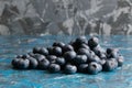 Blueberry berry on table close up macro, blue concrete background with copy space Royalty Free Stock Photo