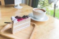 blueberry cake and hot coffee mocha with foam milk Royalty Free Stock Photo