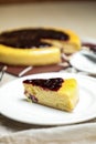 Blueberry Cheesecake slice include caramel with fork and knife served in plate isolated on table top view of cafe bake food Royalty Free Stock Photo