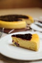 Blueberry Cheesecake slice include caramel with fork and knife served in plate isolated on table top view of cafe bake food Royalty Free Stock Photo