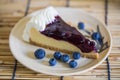 Blueberry cheesecake on the wooden background with blueberries Royalty Free Stock Photo