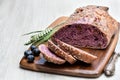 Blueberry and chia seed bloomer on white wooden table