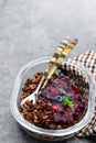 Blueberry crisp baked oatmeal on gray background