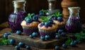 Blueberry cupcakes with fresh blueberries and mint leaves on rustic wooden table Royalty Free Stock Photo