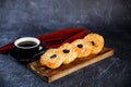 Blueberry Custard Danish served on wooden board with cup of black coffee isolated on napkin side view of french breakfast baked Royalty Free Stock Photo