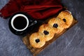 Blueberry Custard Danish served on wooden board with cup of black coffee isolated on napkin top view of french breakfast baked Royalty Free Stock Photo