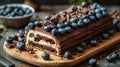 Blueberry dessert bar with fresh berries and chocolate pieces on a dark background