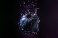 Blueberry falling into water with splashes on a black background. Generative AI