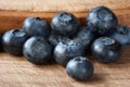 Blueberry. Fresh blueberries on a wooden surface close-up. Sprinkle blueberries. Scattered fresh blueberries. Healthy food concept Royalty Free Stock Photo