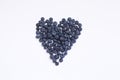 Close up chia seed as texture background.Blueberry heart shape symbol concept for healthy eating and lifestyle