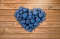 Blueberry heart on wood Royalty Free Stock Photo