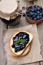 Blueberry jam on bread on wooden table Royalty Free Stock Photo