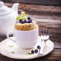 Blueberry Microwave Muffin in mug . Selective focus Royalty Free Stock Photo