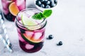 Blueberry Mojito with lime and fresh mint. Iced cold summer drink in glass jar Royalty Free Stock Photo