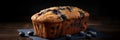 blueberry muffin with berries on a board on a dark background .homemade cakes