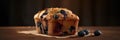 blueberry muffin with berries on a board on a dark background .homemade cakes