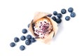 Blueberry muffin with fresh blueberries, isolated on white background, top view Royalty Free Stock Photo