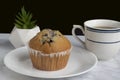 blueberry muffin with a fresh cup of tea