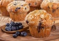 Blueberry Muffin and Spoonful of Berries on a Wooden Plate Royalty Free Stock Photo