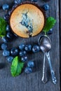 Blueberry muffins and fresh berries on wooden table Royalty Free Stock Photo