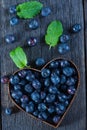 Blueberry muffins and fresh berries on wooden table Royalty Free Stock Photo