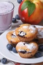 Blueberry muffins, fresh peaches and a milkshake vertical