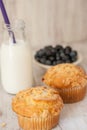 Blueberry Muffins With Glass Jug of Milk