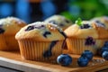blueberry muffins on a wooden cutting board, created by Generative AI Royalty Free Stock Photo