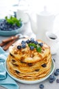 Blueberry pancakes with butter, maple syrup and fresh berries. American breakfast Royalty Free Stock Photo