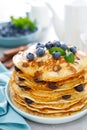 Blueberry pancakes with butter, maple syrup and fresh berries. American breakfast Royalty Free Stock Photo