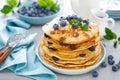 Blueberry pancakes with butter, maple syrup and fresh berries. American breakfast Royalty Free Stock Photo