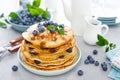 Blueberry pancakes with butter, maple syrup and fresh berries. American breakfast Royalty Free Stock Photo