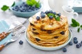 Blueberry pancakes with butter, maple syrup and fresh berries. American breakfast Royalty Free Stock Photo