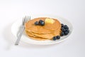 Blueberry pancakes on a plate with fork Royalty Free Stock Photo