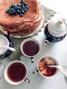 Blueberry pancakes on a set table. Royalty Free Stock Photo