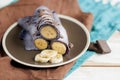 Blueberry pancakes stuffed with whole banana wrapped in a tube and poured with chocolate Royalty Free Stock Photo