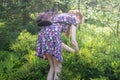 blueberry picking - young woman in summer dress picking blueberries in the forest Royalty Free Stock Photo