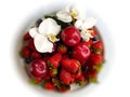 Red Sweet Strawberry With orchid on White Plate Royalty Free Stock Photo