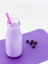 Blueberry smoothie in a glass bottle Royalty Free Stock Photo