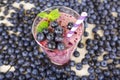 Blueberry smoothie in a glass jar with a straw and sprig of mint Royalty Free Stock Photo