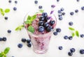 Blueberry smoothie in a glass jar with a straw and sprig of mint Royalty Free Stock Photo