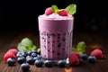 Blueberry smoothie or milkshake with fresh berries, a healthy breakfast