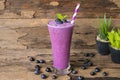 Blueberry smoothies juice beverage healthy the taste yummy In glass drink episode morning on wooden background. Royalty Free Stock Photo