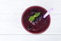 Blueberry smoothies fruit juices and blueberries on a white wooden background from top view. Drink in the morning for good health. Royalty Free Stock Photo